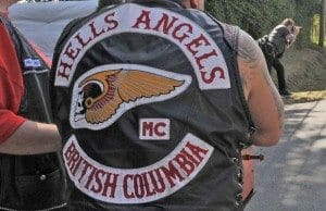 Vancouver B.C. - July 25, 2008 - Roaring past watching police and welcoming bikers a large contingent of riders including some from Quebec arrive at the Hells Angels White Rock clubhouse property at 21764 61 Ave in Langley where a weekend-long party is underway to celebrate the 25th anniversary of Hells Angels chapters in B.C.  Kim Bolan story. (ian lindsay/Vancouver Sun) [PNG Merlin Archive]